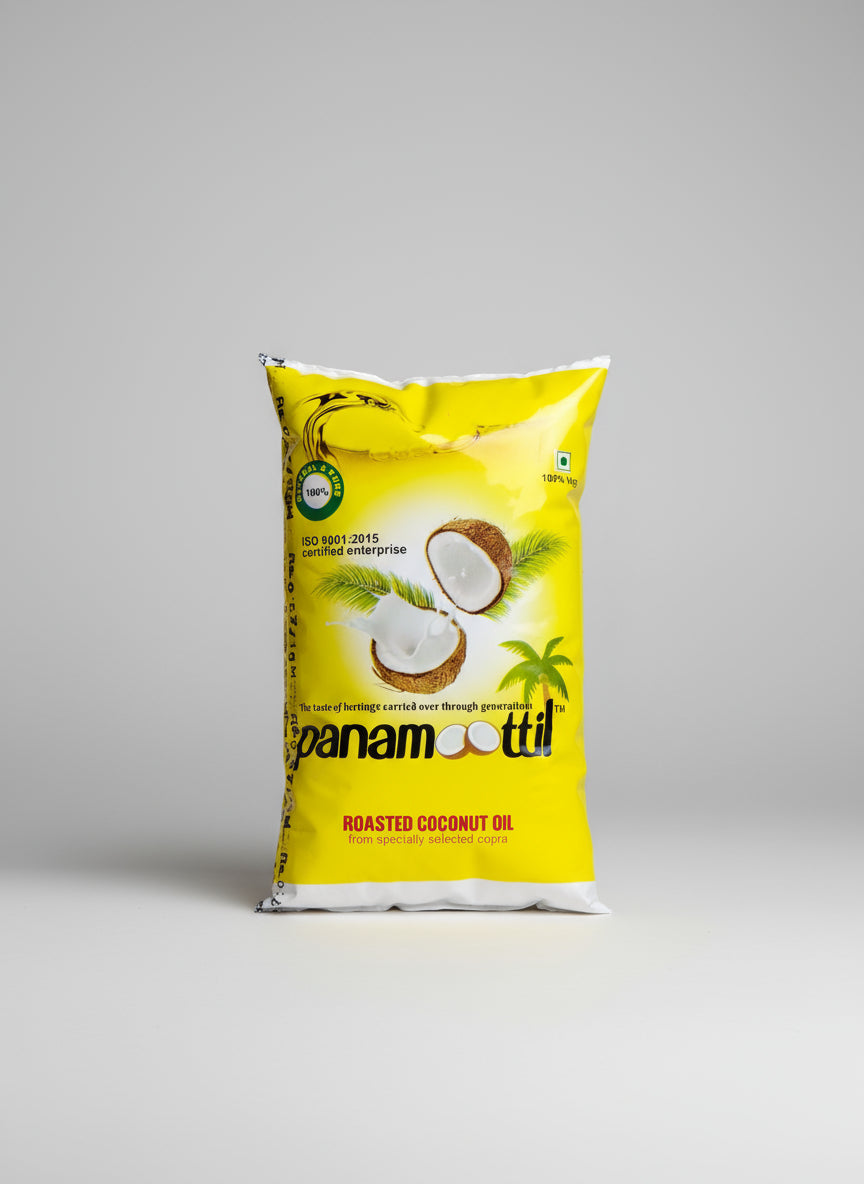 Yellow package of Panamoottil roasted coconut oil on a concrete surface.