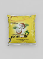 Panamottil coconut oil packaging on a wooden surface